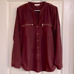 Calvin Klein plum blouse with front zipper details.